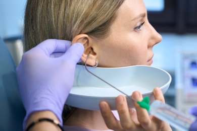 Removing earwax from patient